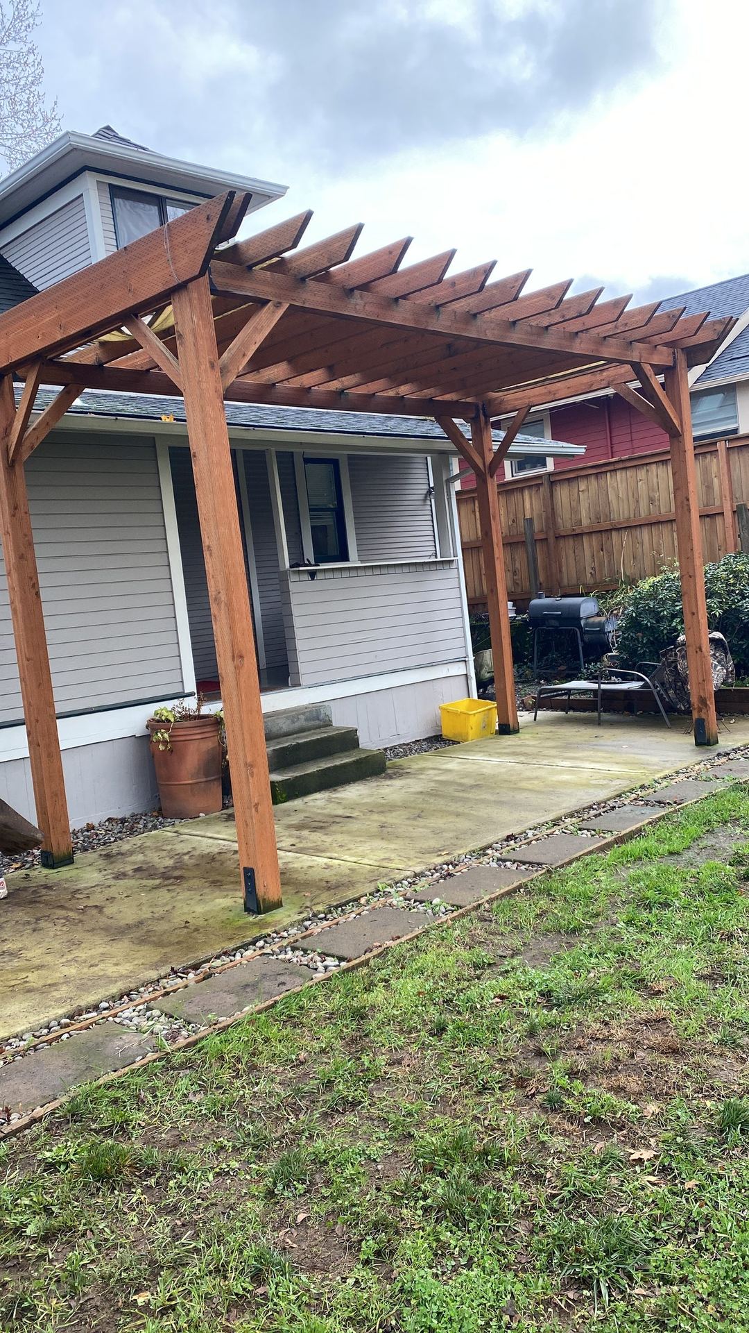 Finished cedar deck and pergola, stained and sealed, on a Portland area home
